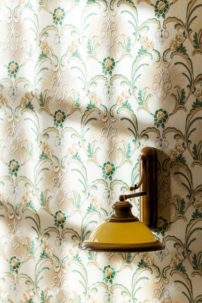vintage rose peel and stick wallpaper in a bedroom
